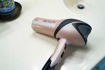 a hair dryer sitting on a counter with a microphone at Chic Retreat Ping Pong, Bonfires and Patio Leisure in San Diego