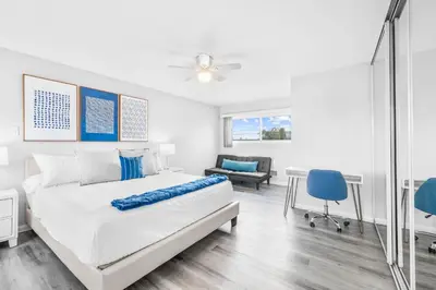 a bedroom with a bed and a table and chairs at Serene Sanctuary Pool, Hot Tub and Game Room in San Diego
