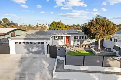 an aerial view of a house with a driveway at Clairemont Mesa Chic 4BR with Patio and Hot Tub in San Diego