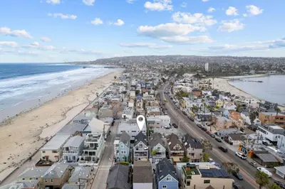 an aerial view of a city and the beach at Ocean Breeze and Rooftop Views Steps to Surf and Sun in San Diego