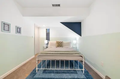 a bedroom with a bed in a white room at Modern Pacific Beach Retreat with Hot Tub and Views in San Diego