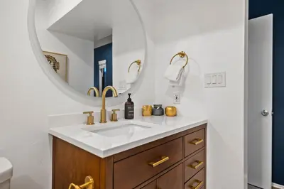 a bathroom with a sink and a mirror at Modern Pacific Beach Retreat with Hot Tub and Views in San Diego