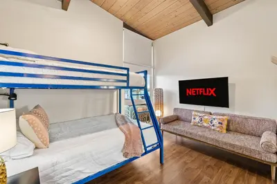 a room with two bunk beds and a couch at Luxury Hilltop Stay Pool, Firepit and Views in La Mesa