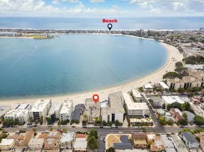 an aerial view of a beach with a red marker at Crown Point 3BR Bay and Beach View Parking W D in San Diego