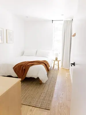 a white bedroom with a bed and a window at Glass Home with Views, Hot Tub, FREE EV Charging! in Bonita