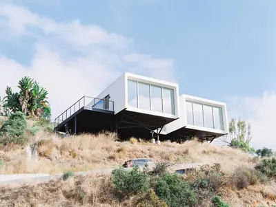 a house on top of a hill at Glass Home with Views, Hot Tub, FREE EV Charging! in Bonita