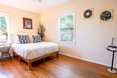 a bedroom with a bed and a window at Walk to Beach • La Jolla Home + Free Parking in San Diego