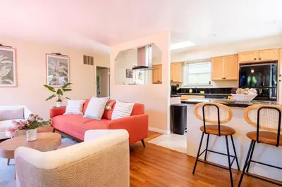 a living room with a couch and a table at Walk to Beach • La Jolla Home + Free Parking in San Diego