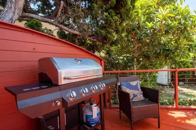 a grill and a chair on a deck at Walk to Beach • La Jolla Home + Free Parking in San Diego