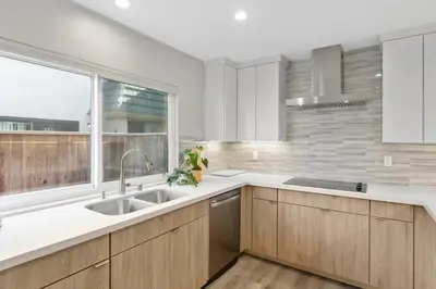 a kitchen with a sink and a window at Solana Beach Escape, Beach Access, AC, Pools, Spa, Tennis Courts & Clubhouse Views in Solana Beach