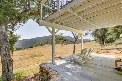 a porch of a house with a pergola at 320 Acres Farmhouse in East County San Diego