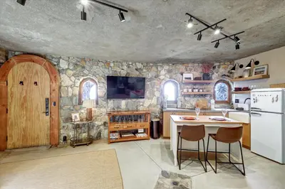 a kitchen with a white refrigerator and a table at Casa Grotto in San Marcos