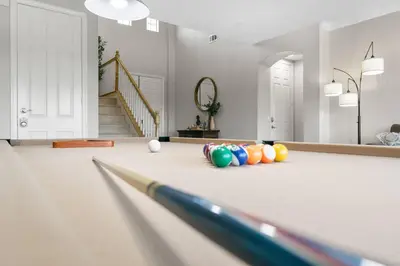 a bowling alley with pins and balls on the floor at Sunset Crest - Home with stunning views, Pool, BBQ in Fallbrook