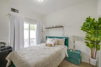 a bedroom with a bed and a potted plant at Golden Hill Gem 2 Mi to Gaslamp Quarter - Dogs OK! in San Diego