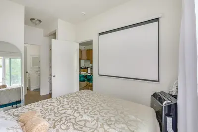 a bedroom with a bed and a large mirror at Golden Hill Gem 2 Mi to Gaslamp Quarter - Dogs OK! in San Diego