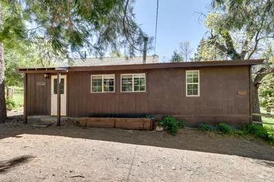a small brown house with windows and a driveway at Hike, Bike and Explore Woodsy Retreat in Mt Laguna! in Mount Laguna