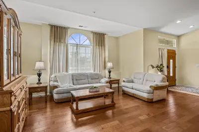 a living room with two couches and a table at Explore Ramonas Vineyards Tranquil Home with Yard in Ramona