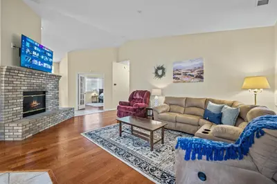 a living room with a couch and a fireplace at Explore Ramonas Vineyards Tranquil Home with Yard in Ramona