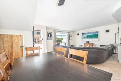 a living room with a couch and a table at Pet-Friendly 3Br Retreat One House From The Sand By Beachview Rentals in Newport Beach