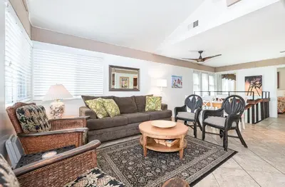 a living room with a couch and chairs and a table at Retro 3Br Split-Level W Oceanview Patio Steps To Sand By Beachview Rentals in Newport Beach