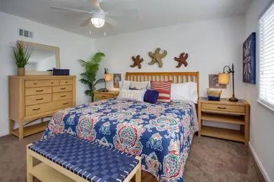 a bedroom with a bed and a ceiling fan at 4Br Coastal Retreat Seconds From Popular 40Th Street Beach By Beachview Rentals in Newport Beach