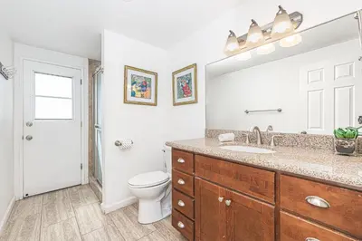 a bathroom with a sink and a toilet at 4Br Coastal Retreat Seconds From Popular 40Th Street Beach By Beachview Rentals in Newport Beach