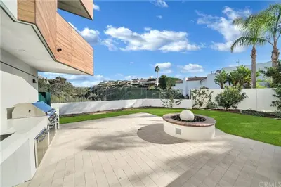 a patio with a fountain in the middle of a house at Luxury Stay Corona del Mar, Short Walk to Beach in Newport Beach