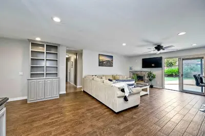 a living room with a couch and a table at Carlsbad Charm - 3BR Stunner in Carlsbad