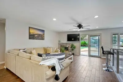 a living room with a couch and a table at Carlsbad Charm - 3BR Stunner in Carlsbad