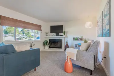 a living room with two couches and a fireplace at Family Retreat - Legoland & Beach in Oceanside
