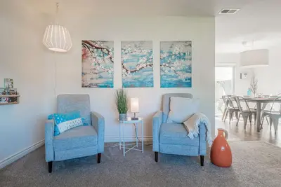a living room with two chairs and a table at Family Retreat - Legoland & Beach in Oceanside