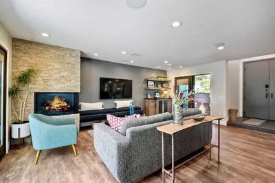 a living room with two couches and a fireplace at Fresh & Modern 3BR - Just Blocks from Beach in Encinitas