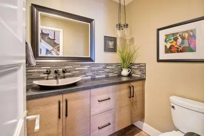 a bathroom with a sink and a mirror at Fresh & Modern 3BR - Just Blocks from Beach in Encinitas
