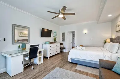a bedroom with a bed and a desk with a computer at La Costa Gem - Condo for 3 in Carlsbad
