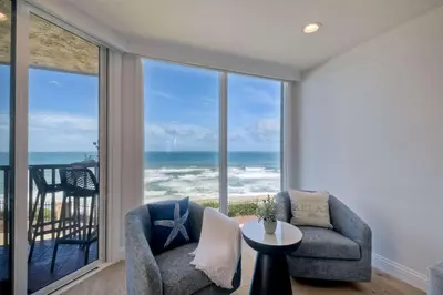 a living room with a view of the ocean at Solana Sunset - Stunning Beachside Retreat for 4 in Solana Beach