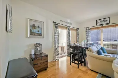a living room with a couch and a table at South Pacific - Walk to Beach in Oceanside