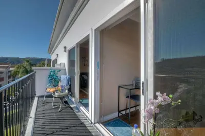 an open balcony with a view of a house at Southern Exposure with Private Balcony in Carlsbad