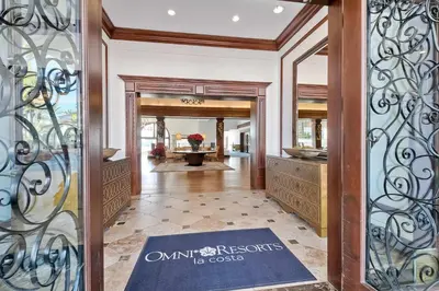an entry door to a home with a wrought iron gate at Southern Exposure with Private Balcony in Carlsbad