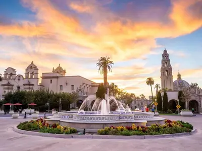 a fountain in front of a building with a cloudy sky at King Bed + Fire Pit | Top Floor w/ Epic Views in San Diego