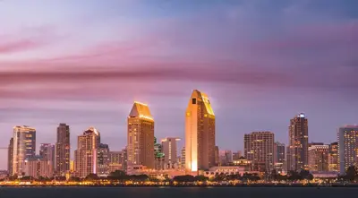 a city skyline with tall skyscrapers at night at King Bed + Fire Pit | Top Floor w/ Epic Views in San Diego