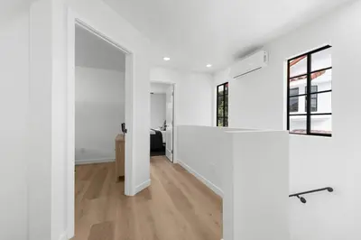 an open hallway with white walls and wood floors at Walk to Mission Bay Firepit AC Putting Green in San Diego
