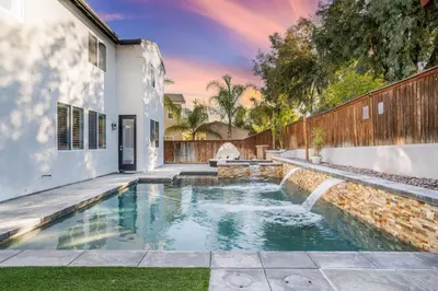 a swimming pool in the backyard of a house at King Bed Temecula Getaway Amazing Pool and Theatre in Murrieta