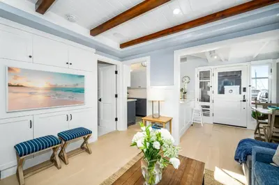 a living room with white walls and a ceiling at Balboa Island Gem with Patio & Beach Essentials in Newport Beach