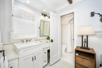 a white bathroom with a sink and a mirror at Balboa Island Gem with Patio & Beach Essentials in Newport Beach