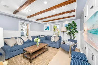 a living room with blue couches and a table at Balboa Island Gem with Patio & Beach Essentials in Newport Beach