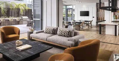 a living room with a couch and a table at Penthouse High-Rise Ocean & City Views in San Diego