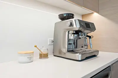 a coffee machine sitting on a counter in a kitchen at Penthouse High-Rise Ocean & City Views in San Diego