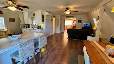 a kitchen and living room with a counter and a table at Julian Barn-Partment in Santa Ysabel