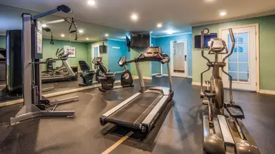 a gym with several treadmills and cardio machines at Best Western PLUS La Mesa San Diego in La Mesa