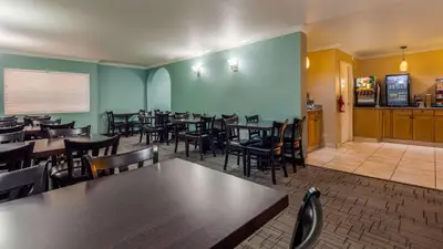a dining room filled with tables and chairs at Best Western PLUS La Mesa San Diego in La Mesa